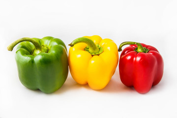 Fresh peppers. Three sweet Red, Yellow, Green Peppers isolated on white background.
