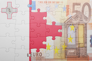 puzzle with the national flag of malta and euro banknote