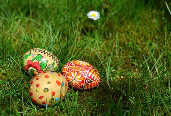 Colorful painted easter eggs on a green grass