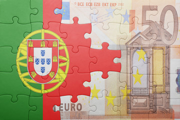 puzzle with the national flag of portugal and euro banknote