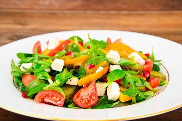 Healthy and Diet Food: Salad, Persimmon, Pickled Cucumber, Tomat