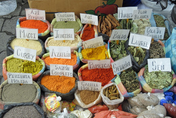Different bags of colored spices