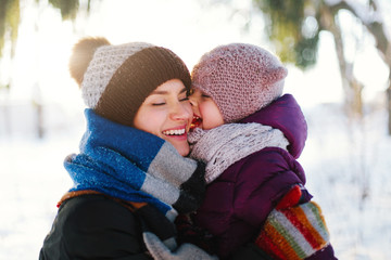 Portrait of cheerful mother and daughter
