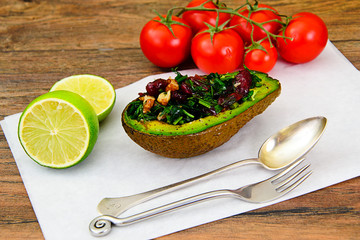 Avocado salad with herbs dill, parsley, cilantro, nuts and sun