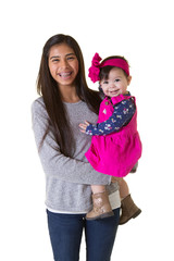 A teenager holding her baby sister