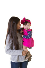 A teenager holding her baby sister