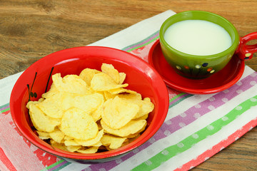 Potato Chips and Milk on Wood.