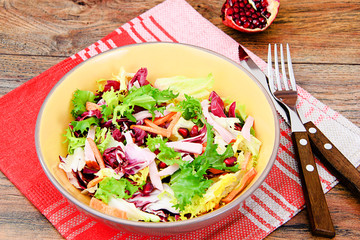 Arugula salad, spinach, iceberg, Cabbage with garnet and ham 