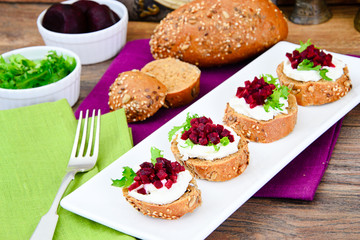 Bruschetta with Goat Cheese, Arugula and Beet, Salt, Pepper, Hon