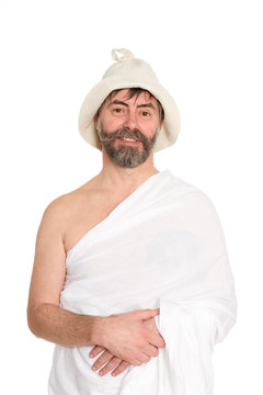 Smiling man of middle-aged men dressed in traditional bath. From a series of Russian bath.