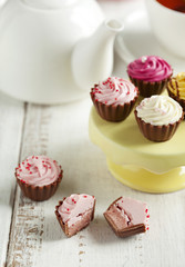 Delicious chocolate candies. Raspberry cupcake.