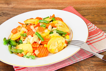 Steamed vegetables potatoes, carrots, corn, green beans, onion