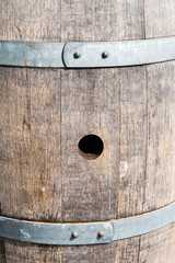 Bung hole in old wood barrel between bands