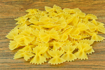 Pasta Bow on Wooden Background.