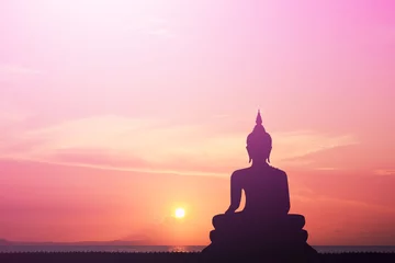 Tuinposter Boeddha Boeddha silhouet Hemelachtergrond