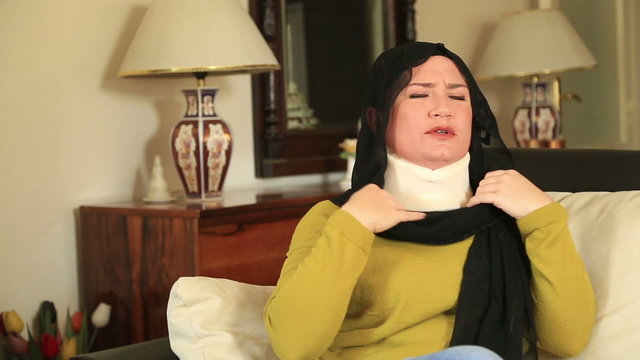Muslim woman with neck brace