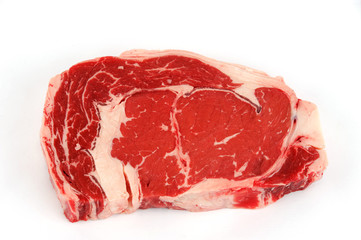 fresh raw rib eye steak on white background