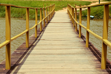Fototapeta premium Steel and Wood bridge over a lagoon