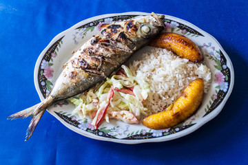 Fish, rice, bananas and a salad. Meal on Carribean coast of Colombia
