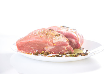 piece of raw meat with spices