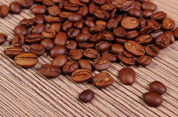 Heap of coffee on wooden background