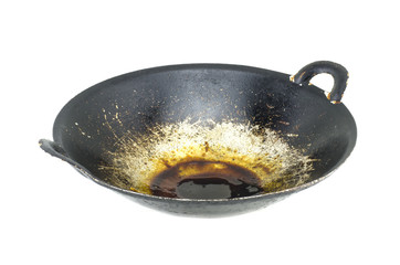 black wok frying pan with grease after frying, isolated on white background