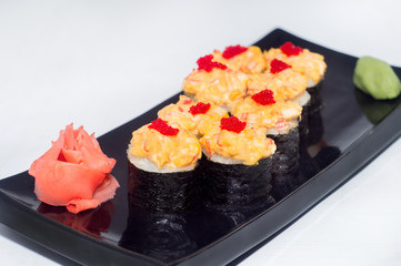 hot baked sushi rolls with wasabi and ginger cheese with red caviar