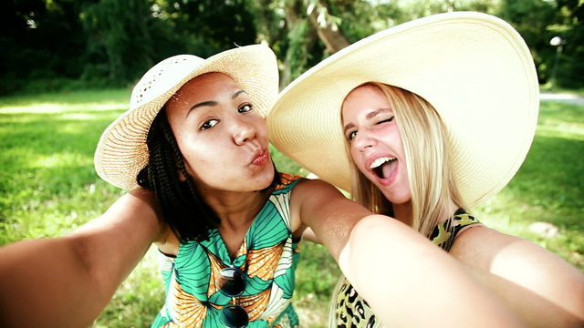 Two young women having fun while taking a selfie