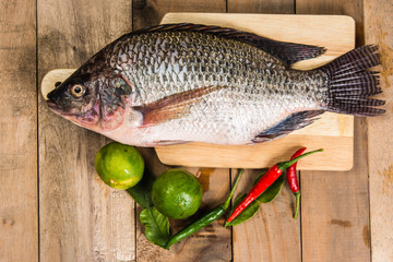 Fresh raw fish on the wood