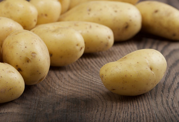 potatoes on a wooden background