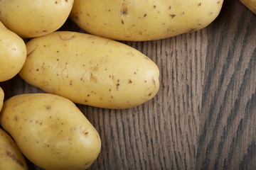 potatoes on a wooden background