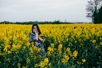 Spring walk girl in a beautiful cherry orchard