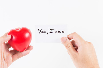 A man's hand handle with heart and a card