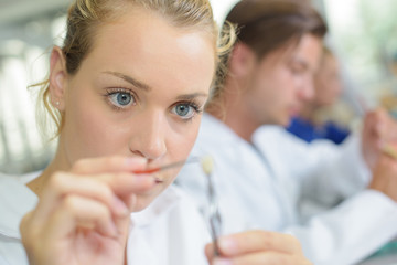 Close up of female dental technician working