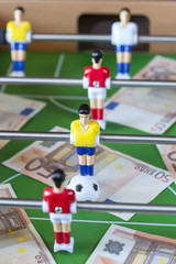 Sports and money. Concept about money spending in football (soccer), sports betting and manipulated fixed matches
