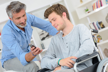 man showing a message to a young man