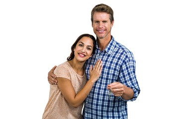 Portrait of cheerful couple holding home keys