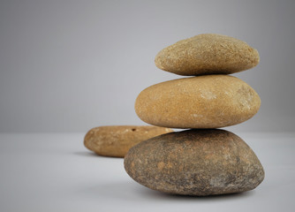 Fototapeta na wymiar stone balance on gray background