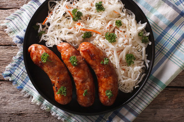 grilled sausages and sauerkraut. horizontal top view

