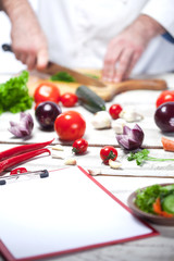 Chef cutting a green parsley his kitchen