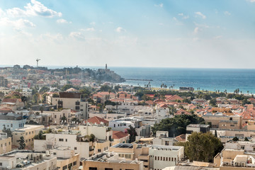 view of a modern city, city of Tel Aviv, in winter with clouds