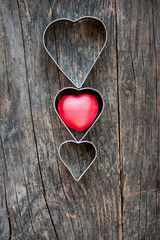 Red heart shape on a wooden background