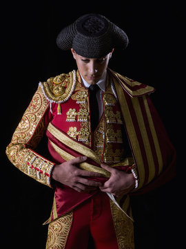 Young bullfighter, dressed in traditional costume to fight