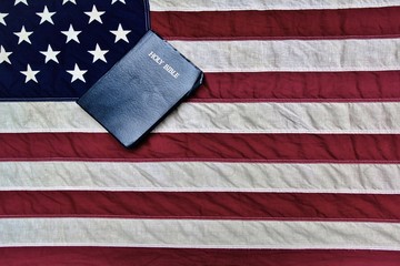American Flag And Bible. The United States flag and a King James Bible.