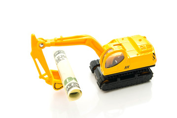 dollars banknotes and backhoe