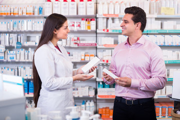 Fototapeta na wymiar Pharmacist and customer in drugstore .