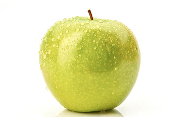 Green apple with droplet on white