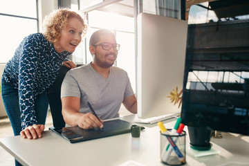 Young creative people working together in office