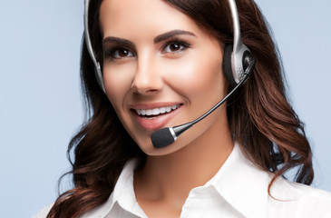 smiling customer support female phone operator in headset