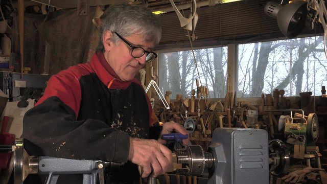 wood turner cutting shapes in wood